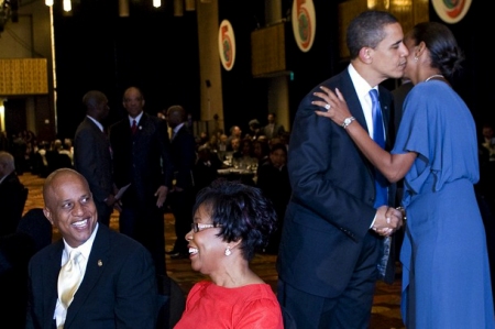 FIRST BLACK LADY OF BELIZE SIMPLIS BARROW GETS A THRILL FROM OUR BLACK PRESIDENT WITH HER HUSBAND SMILING NEARBY!